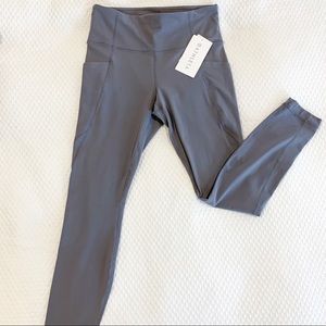 Athleta stash pocket salutation tight